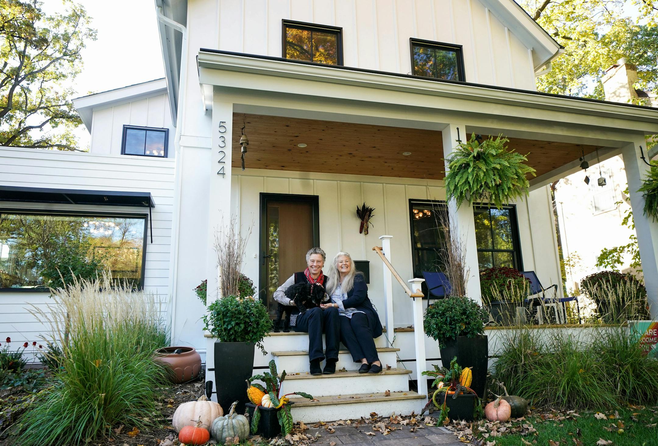 Coleen Carey and Pam Endean with their cockapoo Cricket in their South Minneapolis farmhouse style home. ] GLEN STUBBE &#xef; glen.stubbe@startribune.com Monday, October 15, 2018 Lede/display: Farmhouse chic. The "urban farmhouse" has become ubiquitous in some Twin Cities neighborhoods. EDS, L to R