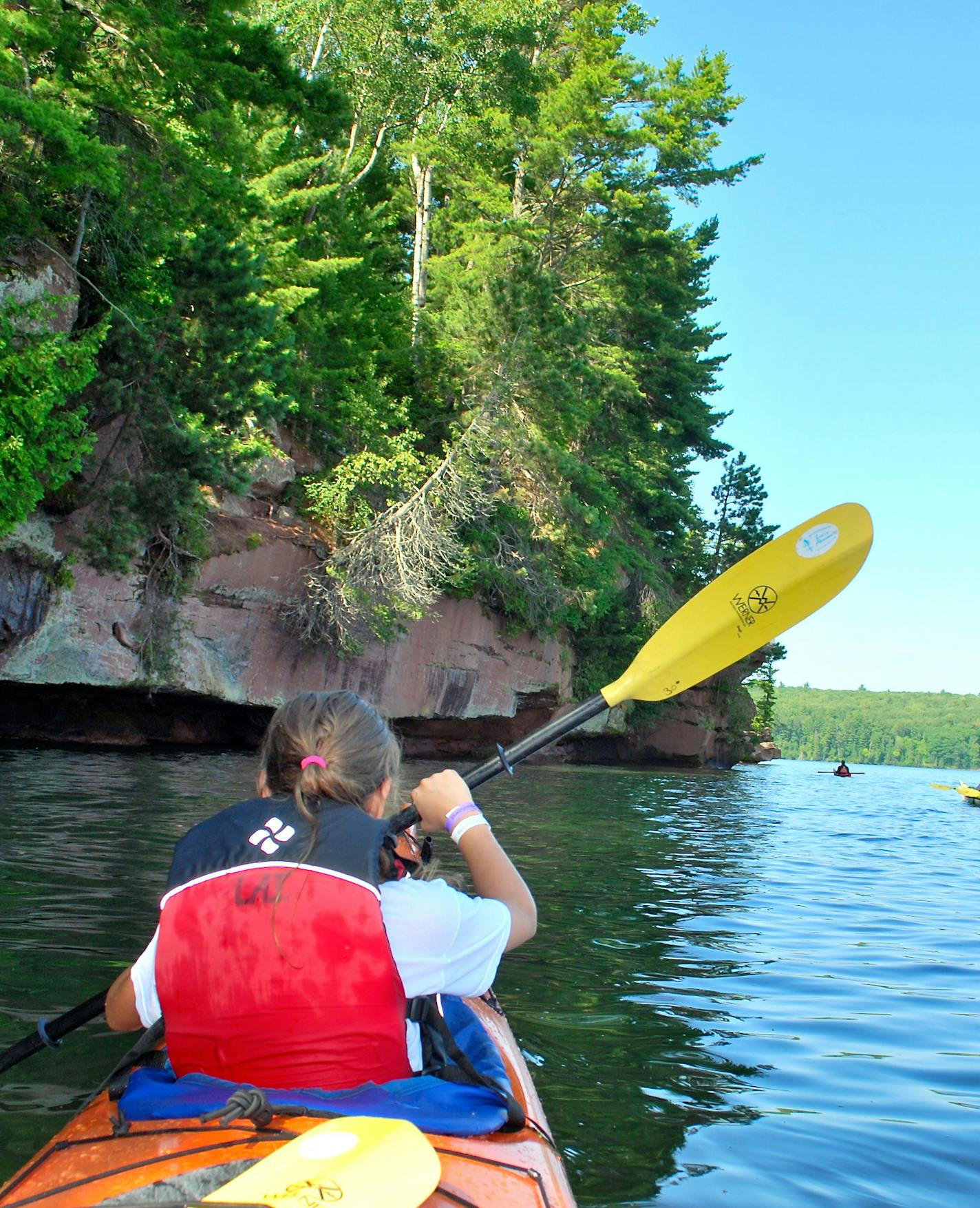 Bob Timmons; robert.timmons@startribune.com Rocky outcroppings towered over sea kayakers just north of Red Cliff, Wis., during a half-day paddle near some of the Apostle Islands.