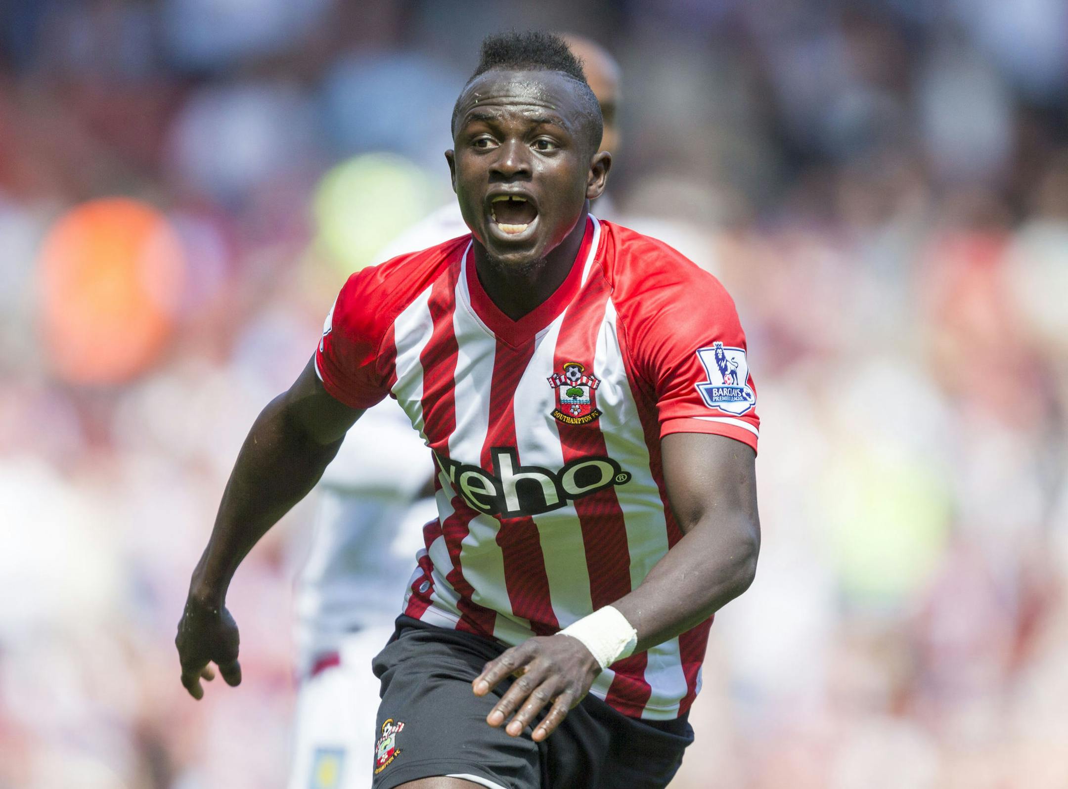 Southampton's Sadio Mane celebrates scoring the fastest hat-trick in Premier League history, during their English Premier League soccer match against Aston Villa at St Mary's, Southampton, England, Saturday, May 16, 2015. The Senegal midfielder's hat trick was timed at 2 minutes, 56 seconds at St Mary's Stadium. (Chris Ison/PA via AP) UNITED KINGDOM OUT - NO SALES - NO ARCHIVES