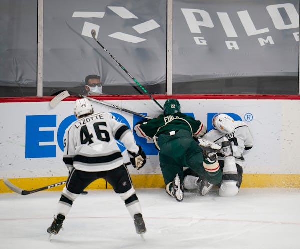 Kevin Fiala of the Wild drove Kings defenseman Matt Roy into the boards Thursday night at Xcel Energy Center. Fiala got a boarding major and was eject