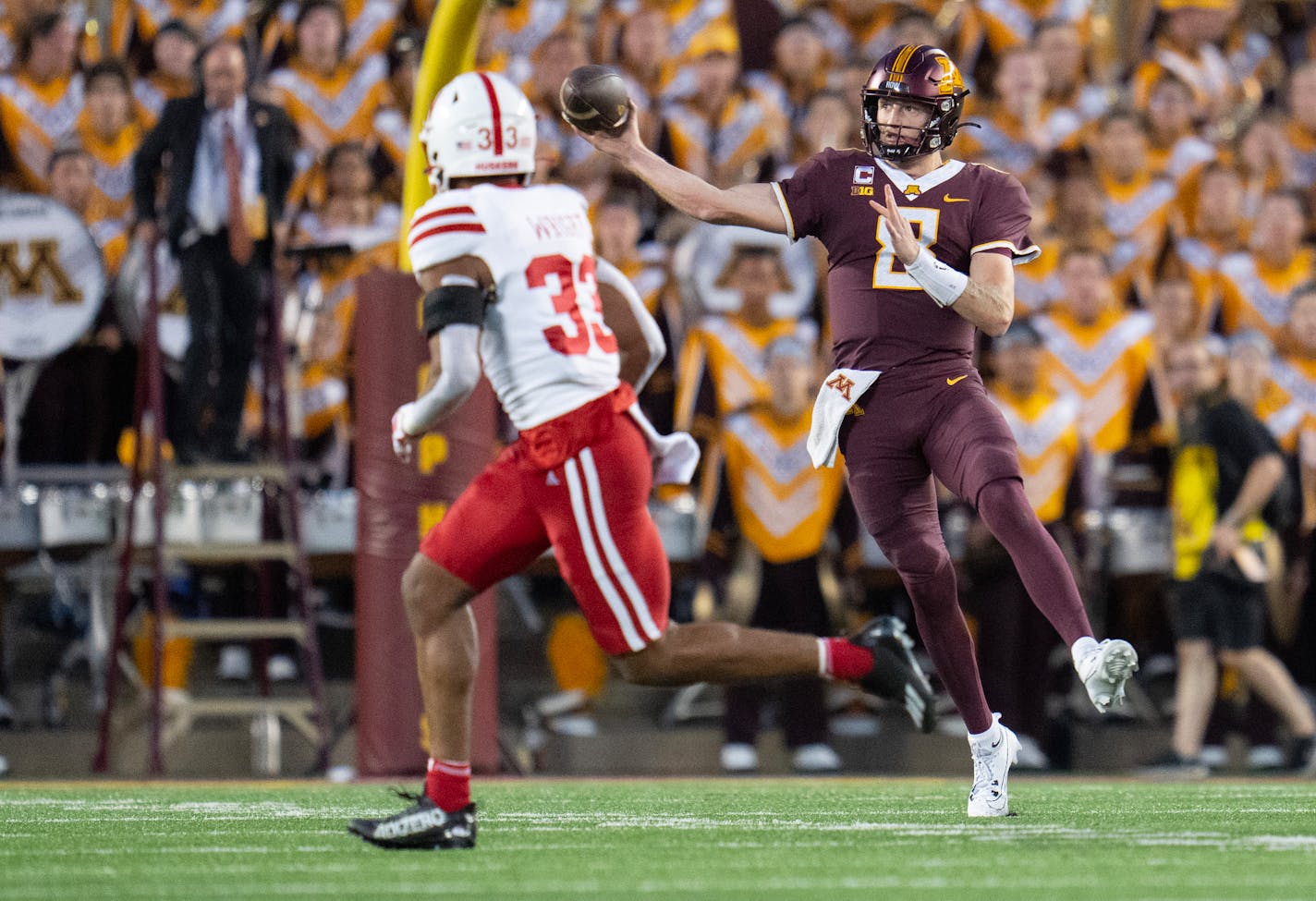 Gophers quarterback Athan Kaliakmanis throws an-off balance pass over Nebraska linebacker Javin Wright in the second quarter Thursday.