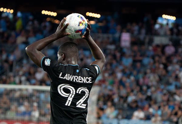 Minnesota United defender Kemar Lawrence (92) throws in the ball in the second half of a match against D.C. United Saturday, July 16, 2022 at Allianz 