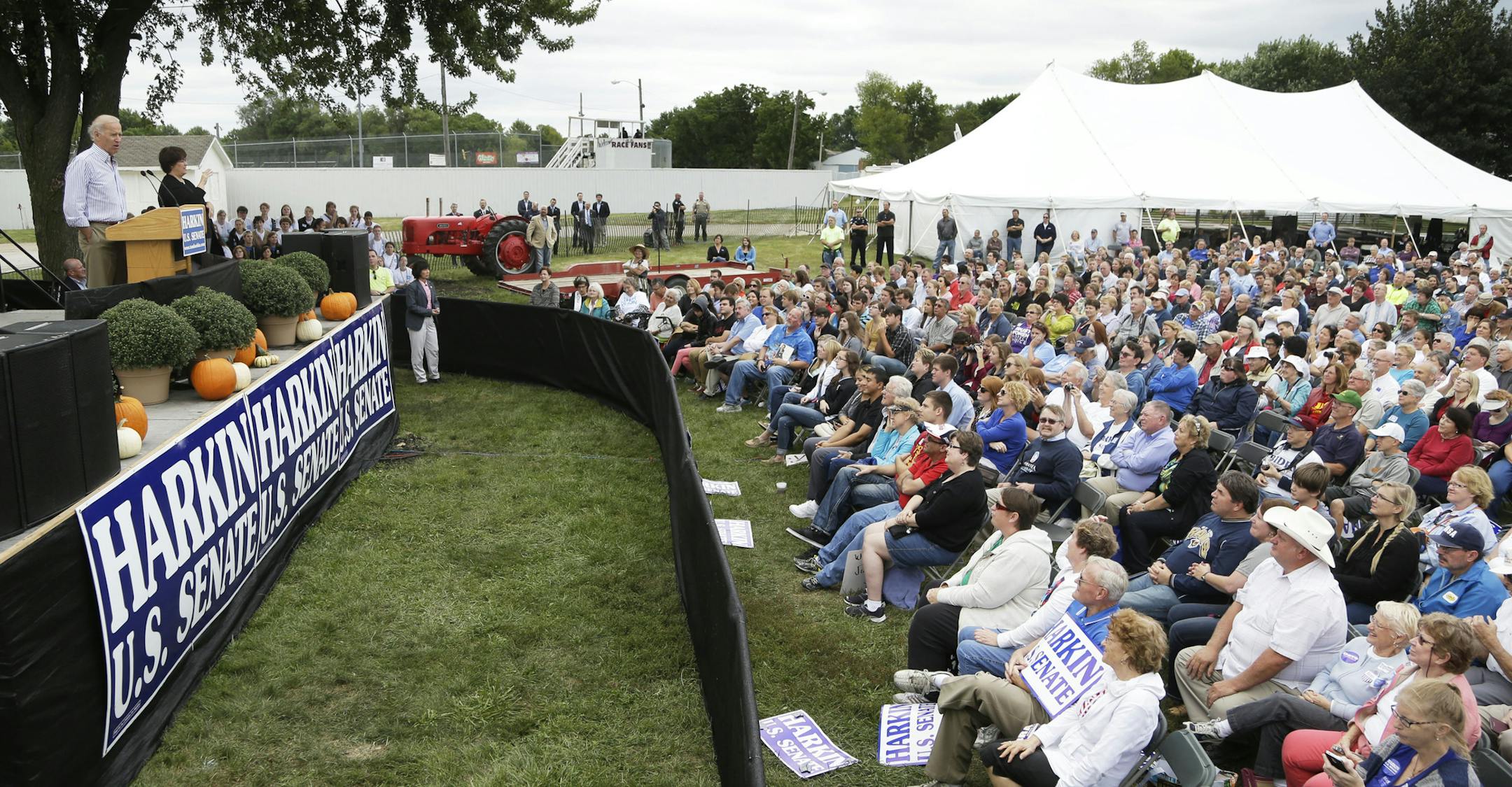 Vice President Joe Biden, left, speaks during Iowa Sen. Tom Harkin's annual fundraising steak fry dinner, Sunday, Sept. 15, 2013, in Indianola, Iowa. (AP Photo/Charlie Neibergall)