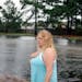 Cindy Caster surveys the floodwaters inundating her neighborhood in Wilmington, N.C.