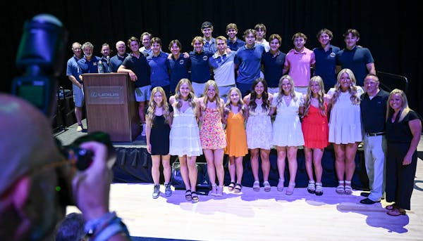 Members of the boys team of the year, Mahtomedi Hockey, and girls team of the year, Rosemount Softball, stand for a photo at last year's All-Metro Spo