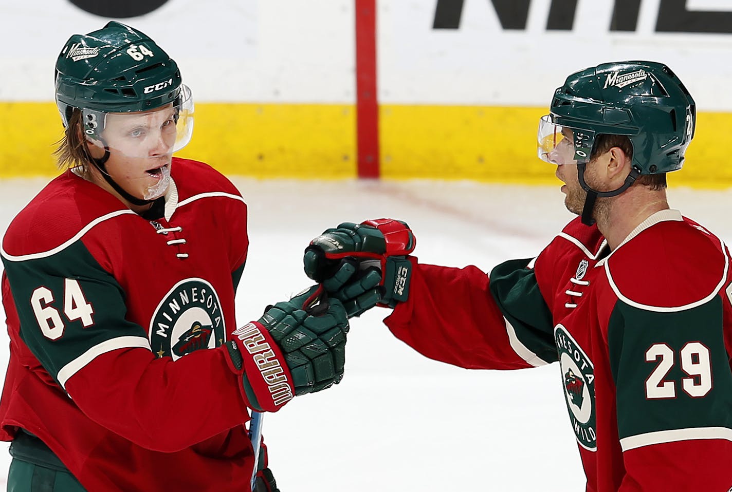 Mikael Granlund (64) celebrated with Jason Pominville (29). after scoring a goal in the second period. ] CARLOS GONZALEZ &#xef; cgonzalez@startribune.com - September 21, 2015, St. Paul, MN, Xcel Energy Center, NHL, Minnesota Wild vs. Buffalo Sabres