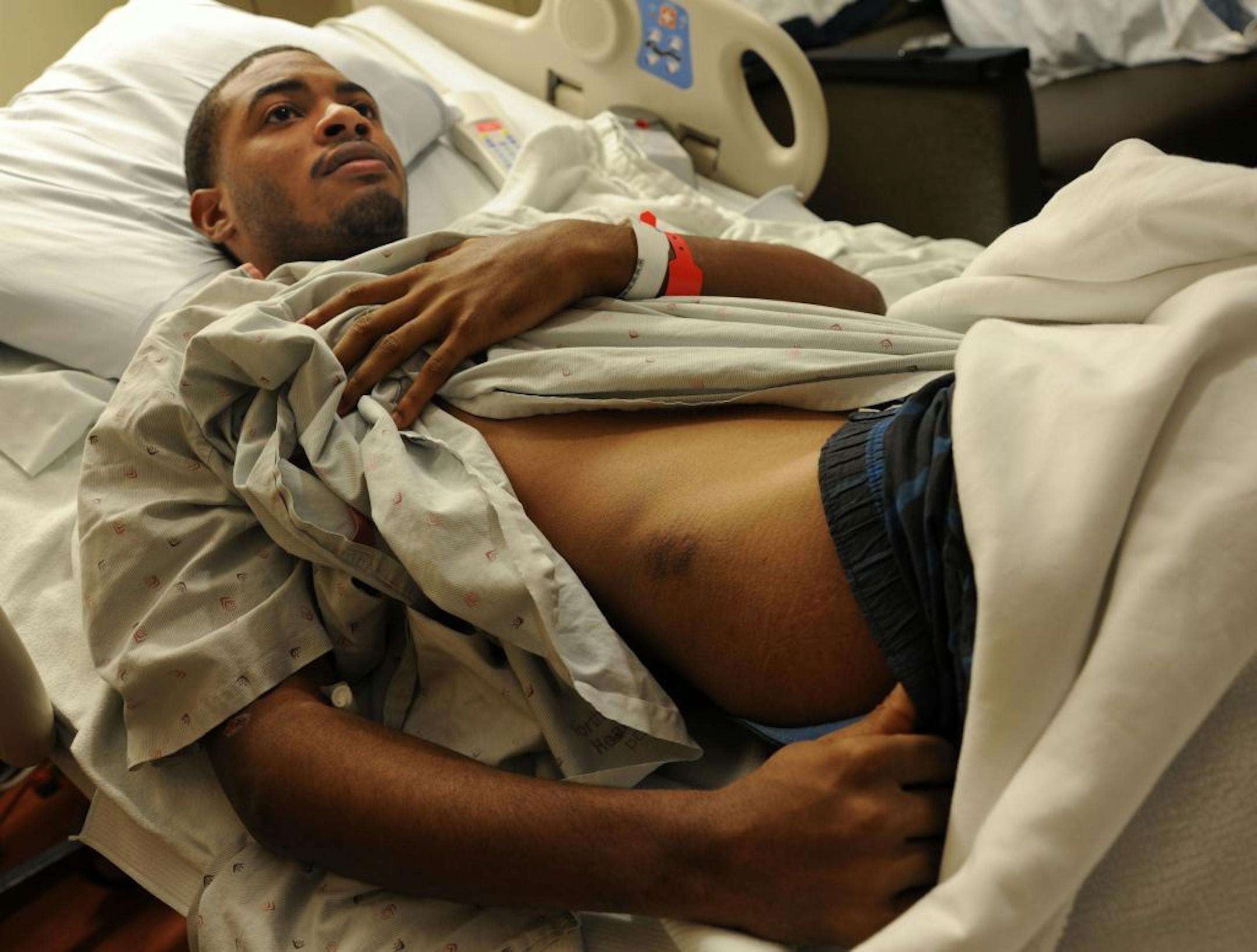 Raejuan Telford showed his wounds to his chest and head in his hospital room at North Memorial Hospital on Friday afternoon April 20, 2012.