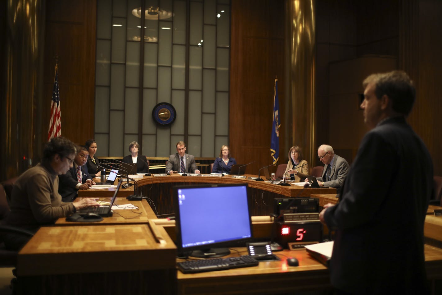 St. Paul Finance Director Todd Hurley, foreground, answered a question from councilmember Dai Thao, second from left, about the Frank Baker settlement before the council voted to approve it. ] JEFF WHEELER &#xef; jeff.wheeler@startribune.com With little fanfare, the St. Paul City Council Wednesday afternoon, April 5, 2017, formally approved the record $2 million settlement with Frank Baker, the innocent man kicked by a police officer and attacked by a police dog.