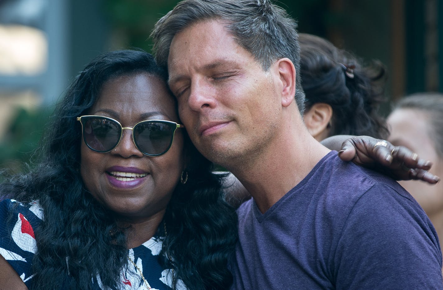 Don Damond, the fiancé of Justine Damond, gets a hug from Valerie Castile, the mother of Philando Castile, during a rally by Damond&#x2019;s home Thursday night in Minneapolis.