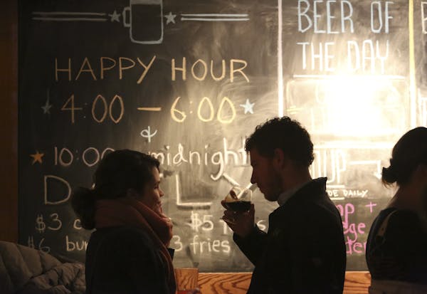 A night on the uptown: Heather Albrecht and Jason Loeffler, above, talked at Republic, a craft-beer bar on the second floor of Calhoun Square in Minne