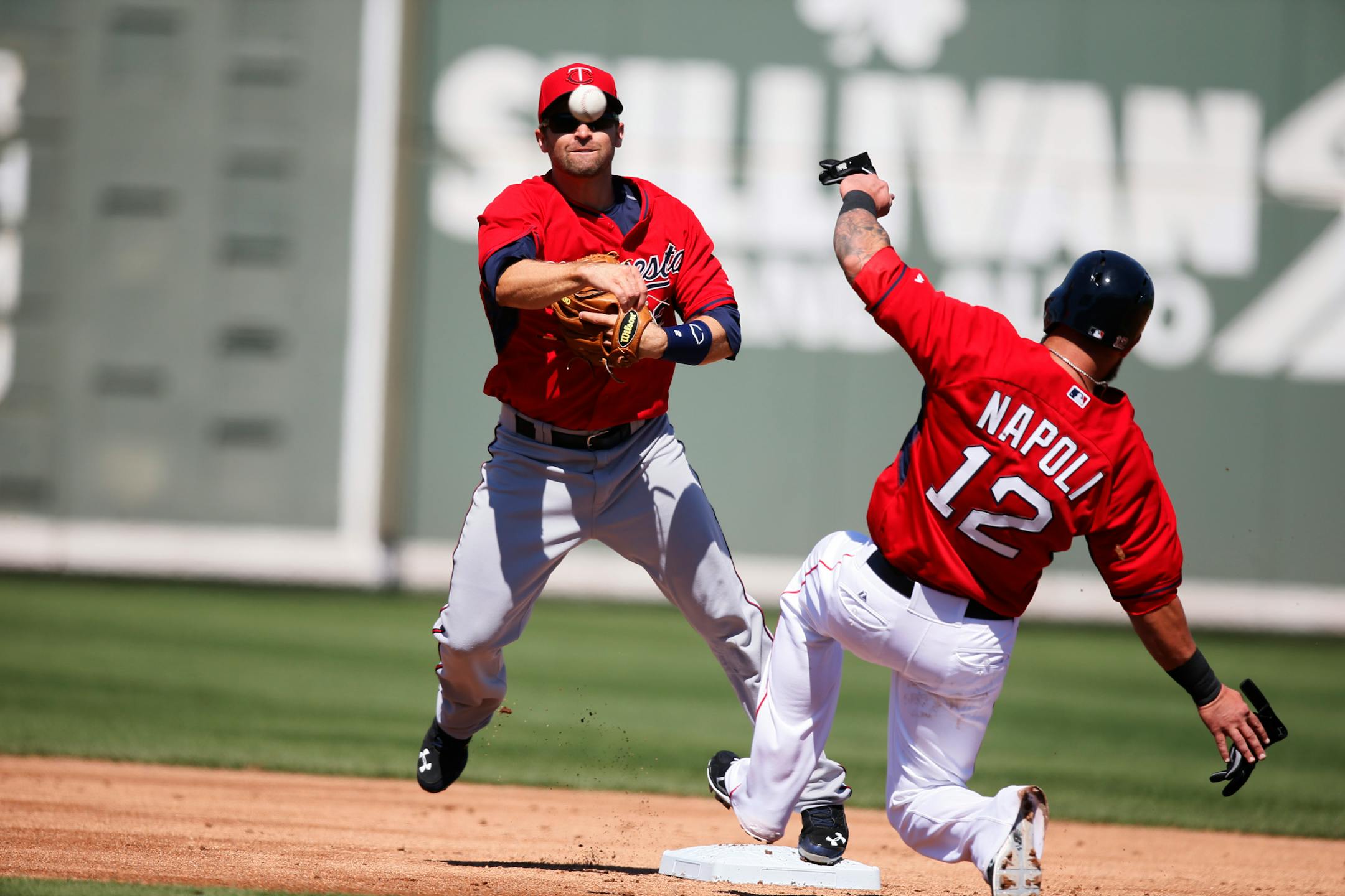 Twins Brian Dozier left completed the double play in both team's fist spring training game Friday Feb 28. 2014 in Fort Myers. Now in his third season with the Twins, Dozier says his accumulated knowledge of hitters helps with his positioning. “Our whole infield is better, and the information we’re sharing helps,” he said.