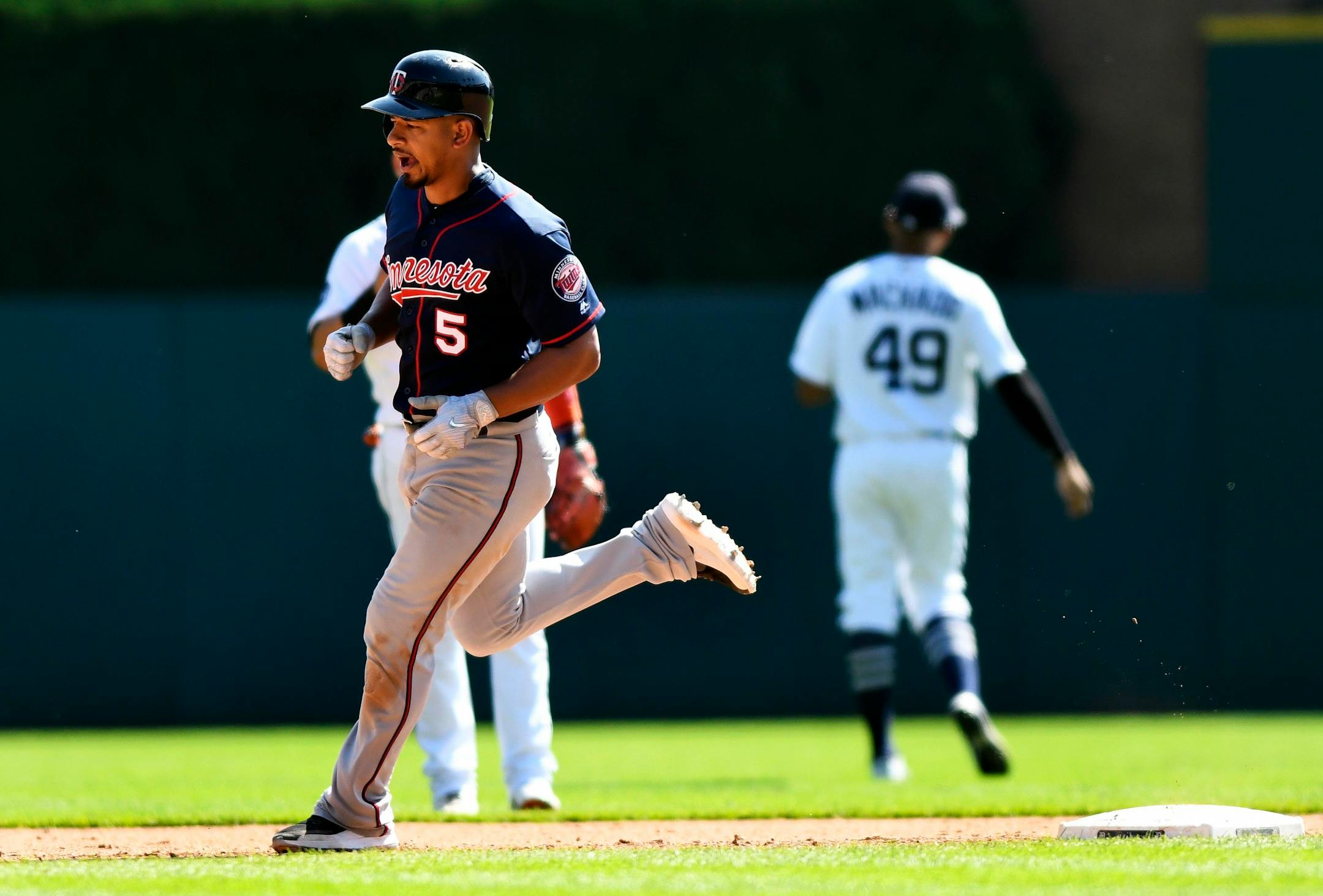 The Twins' Eduardo Escobar circled the bases after hitting a three-run home run during the sixth inning against the Detroit Tigers on Sunday.