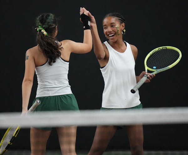 Lauryn Schenck and Zoya Hasan of Edina, l to r, celebrate a play at the Baseline Tennis Center in Minneapolis, Minnesota on Wednesday, Oct. 25, 2023.