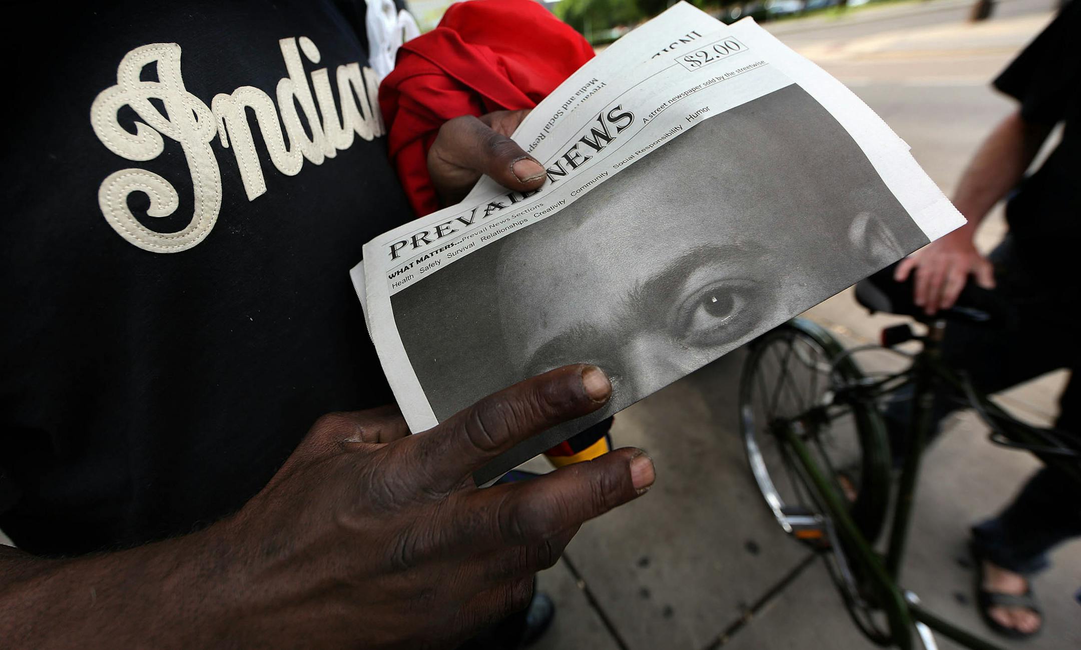 Dwain Willkerson held one of Sedgewick&#xed;s newspapers as the two talked outside the Dorothy Day Center in St. Paul.] JIM GEHRZ &#xef; james.gehrz@startribune.com / St. Paul, MN / June 118, 2015 / 9:00 AM &#xf1; BACKGROUND INFORMATION: Jerry Sedgewick sees them too, the people standing at the side of the freeway off ramps, holding signs asking for money. Sedgewick, 59 and a scientist by training, wanted to do something more meaningful that hand them a couple bucks out his car window. Then, on