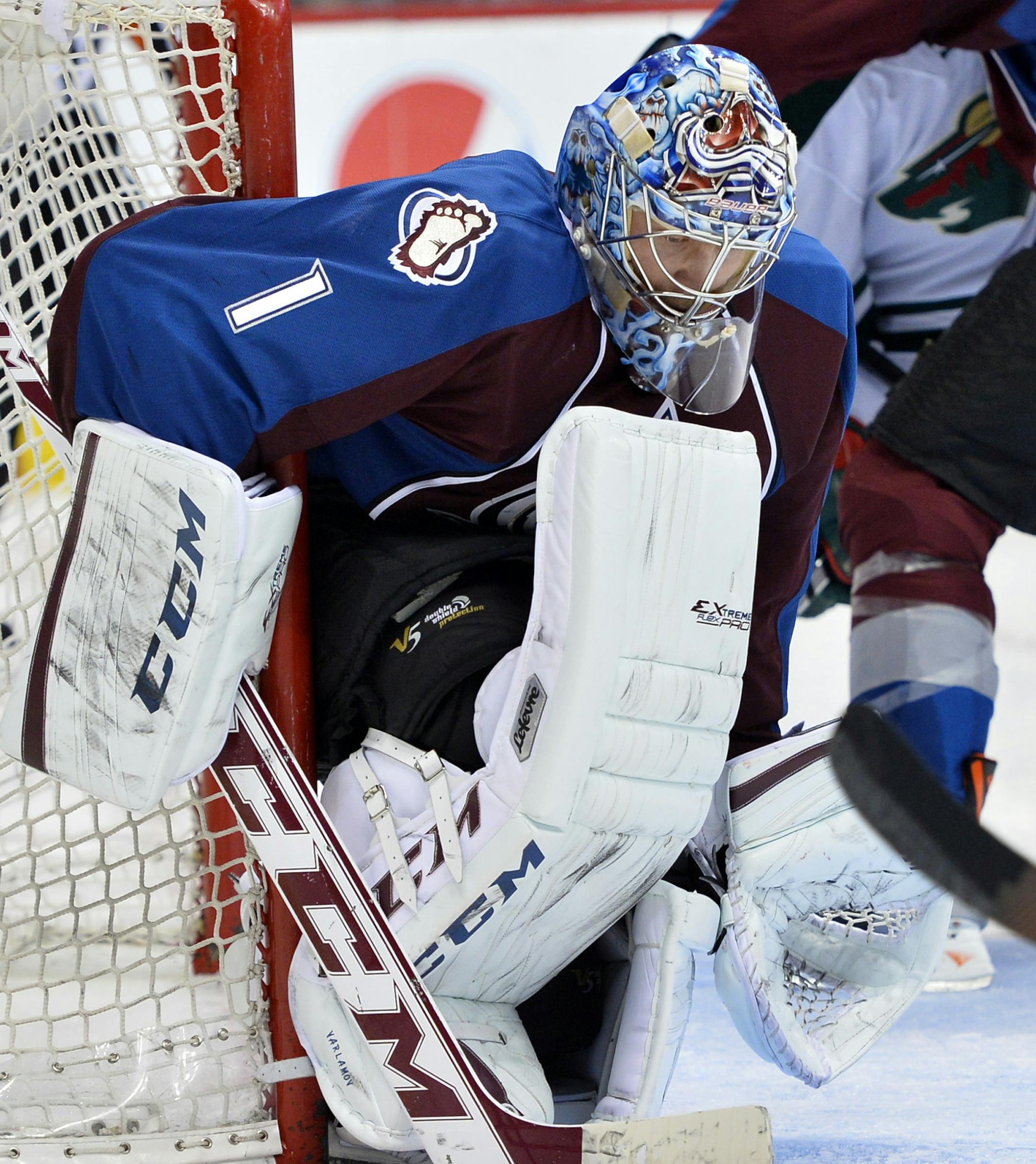 Colorado Avalanche goalie Semyon Varlamov (1) from Russia makes a save against the Minnesota Wild in the second period of Game 2 of an NHL hockey first-round playoff series on Saturday, April 19, 2014, in Denver. (AP Photo/Jack Dempsey)