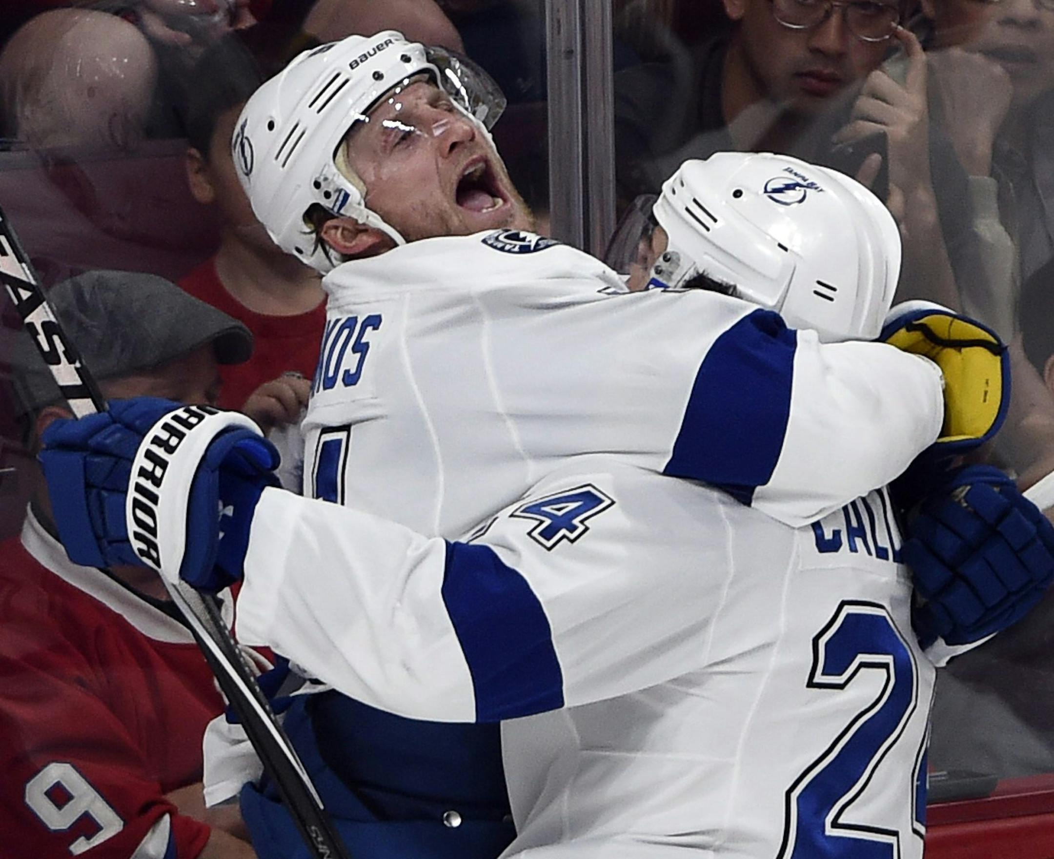 Tampa Bay Lightning center Steven Stamkos (91) celebrates with teammate Ryan Callahan (24) after scoring his team's second goal against the Montreal Canadiens during second period of Game 2 NHL second round playoff hockey action, Sunday, May 3, 2015 in Montreal. (Ryan Remiorz/The Canadian Press via AP)