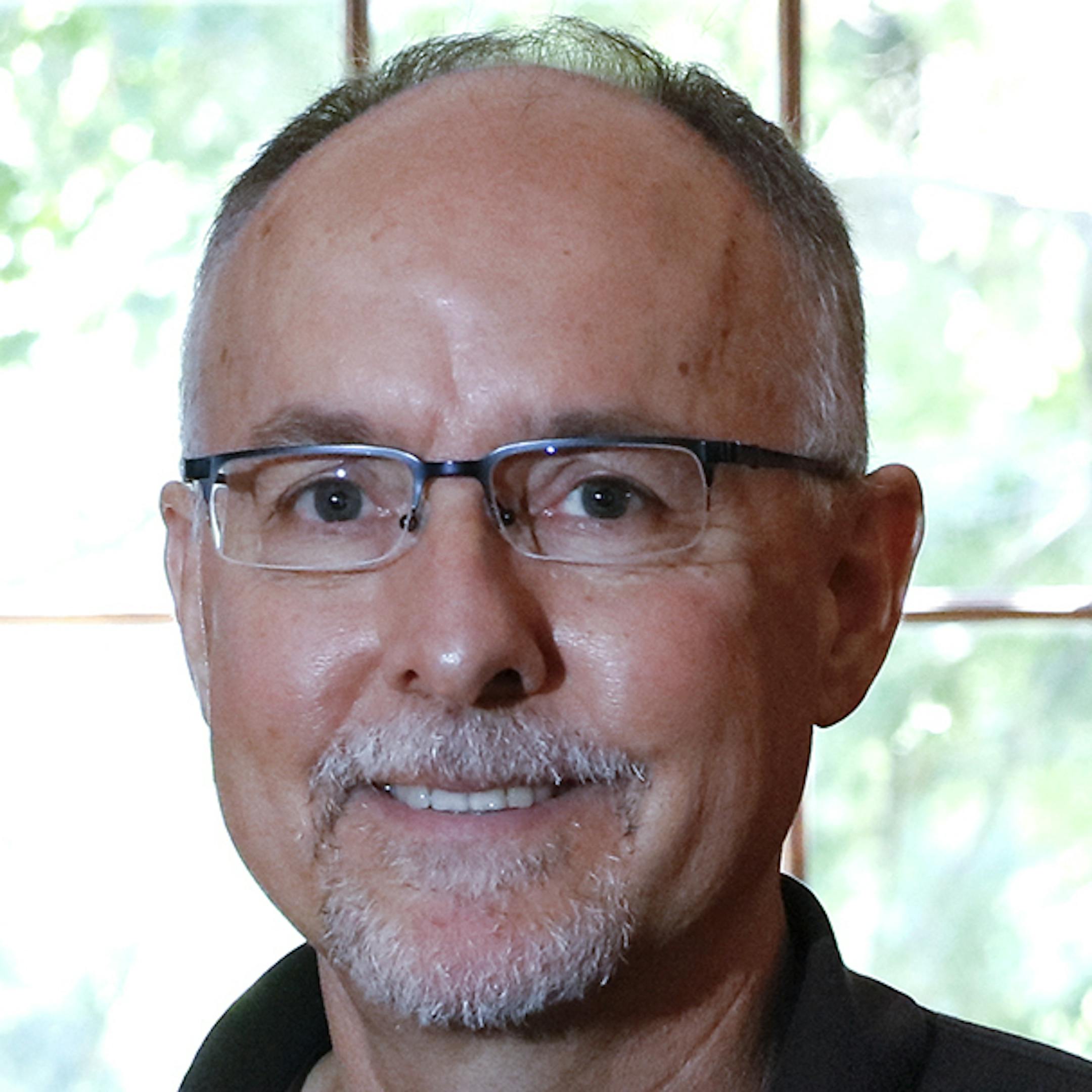 Author Peter OíToole in his Edwin Lundie-designed Cape Cod cottage in St. Paul. Buying his Edwin Lundie-designed house in 2003 ignited a fascination with the architect for Peter O'Toole, who just published a book about Lundie's work.