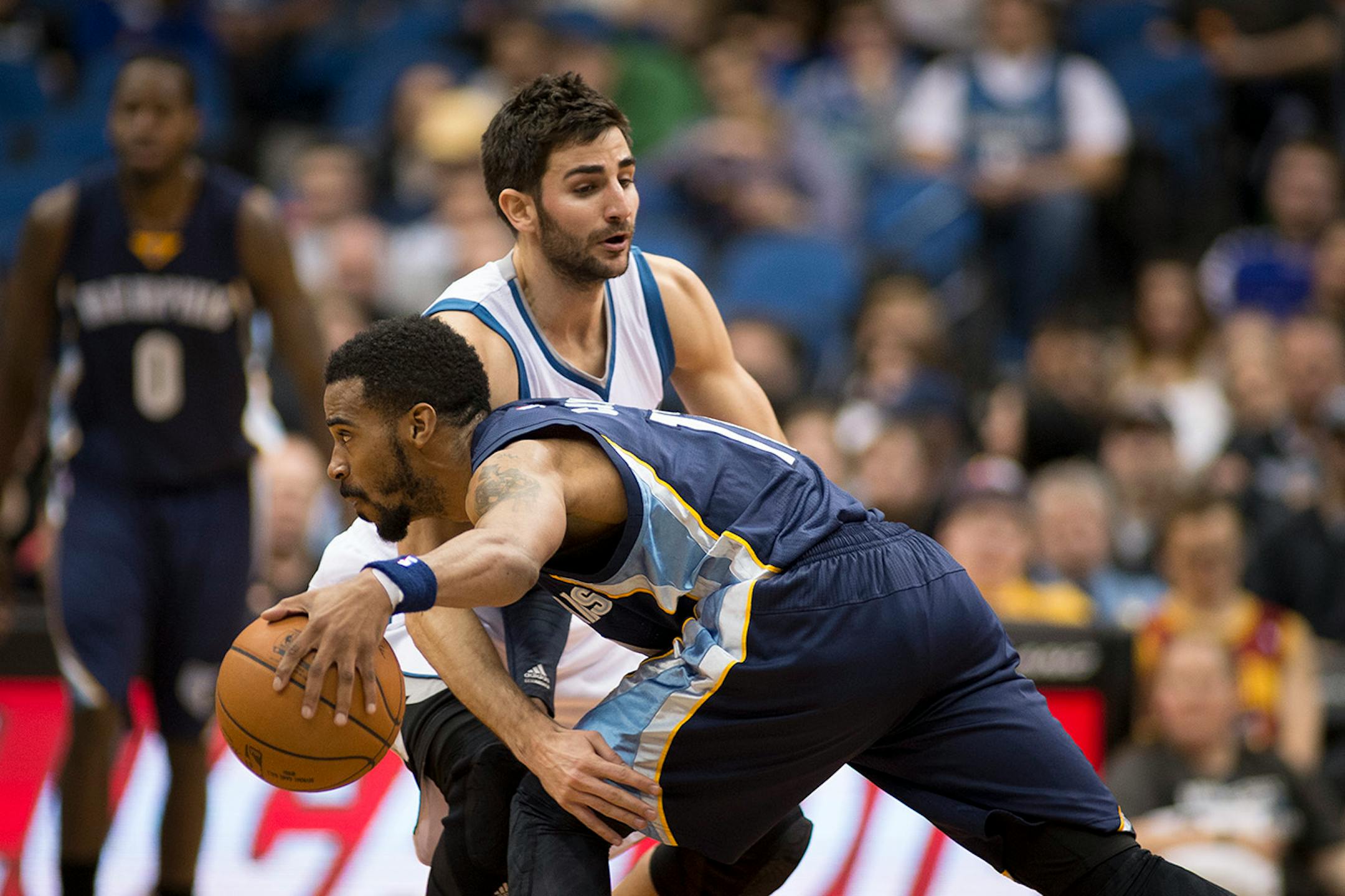 Minnesota Timberwolves guard Ricky Rubio (9) defends against Memphis Grizzlies guard Mike Conley (11) during the second quarter.