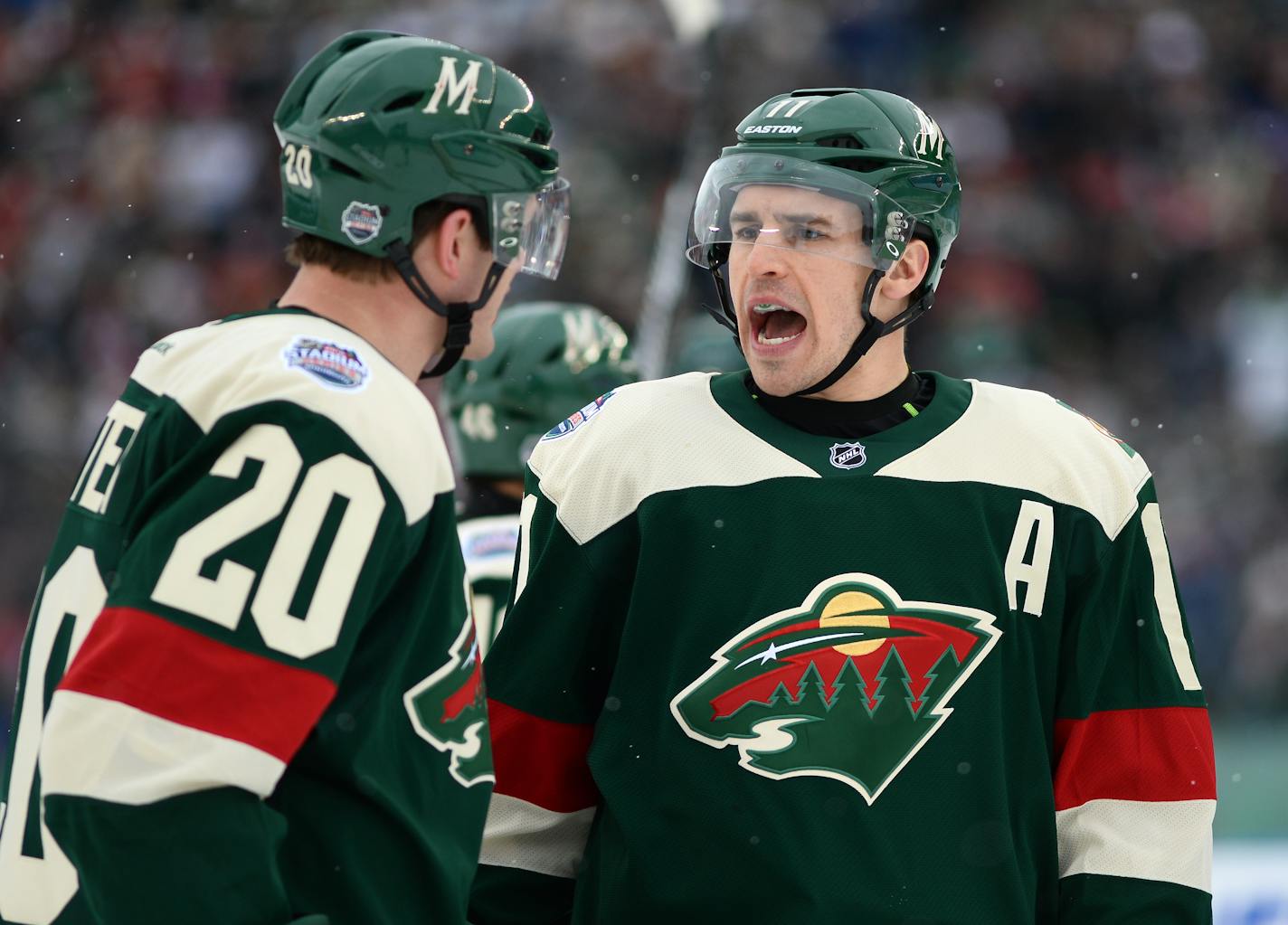 Minnesota Wild defenseman Ryan Suter (20) and left wing Zach Parise (11) talked during a break in the action in the first period against the Chicago Blackhawks. ] (AARON LAVINSKY/STAR TRIBUNE) aaron.lavinsky@startribune.com The 2016 Coors Light NHL Stadium Series game between the Minnesota Wild and the Chicago Blackhawks was held Sunday, Feb. 21, 2016 at TCF Bank Stadium in Minneapolis, Minn.