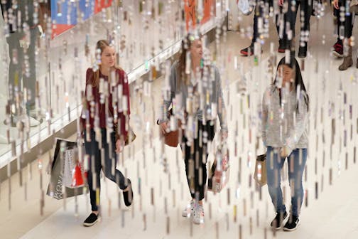 Shoppers walked past lingering Christmas decorations Wednesday at the Mall of America.