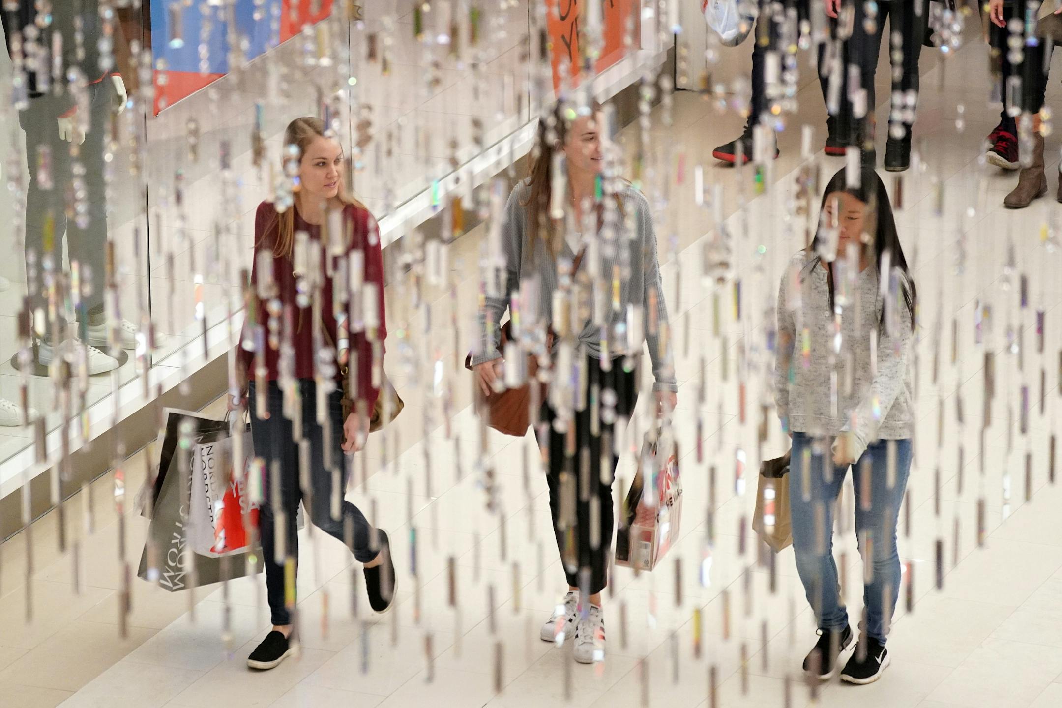 Shoppers walked past lingering Christmas decorations Wednesday at the Mall of America.
