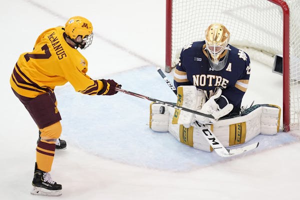 Minnesota Golden Gophers forward Brannon McManus (7) took a shot on Notre Dame Fighting Irish goaltender Cale Morris (32) in the second period. ] ANTH