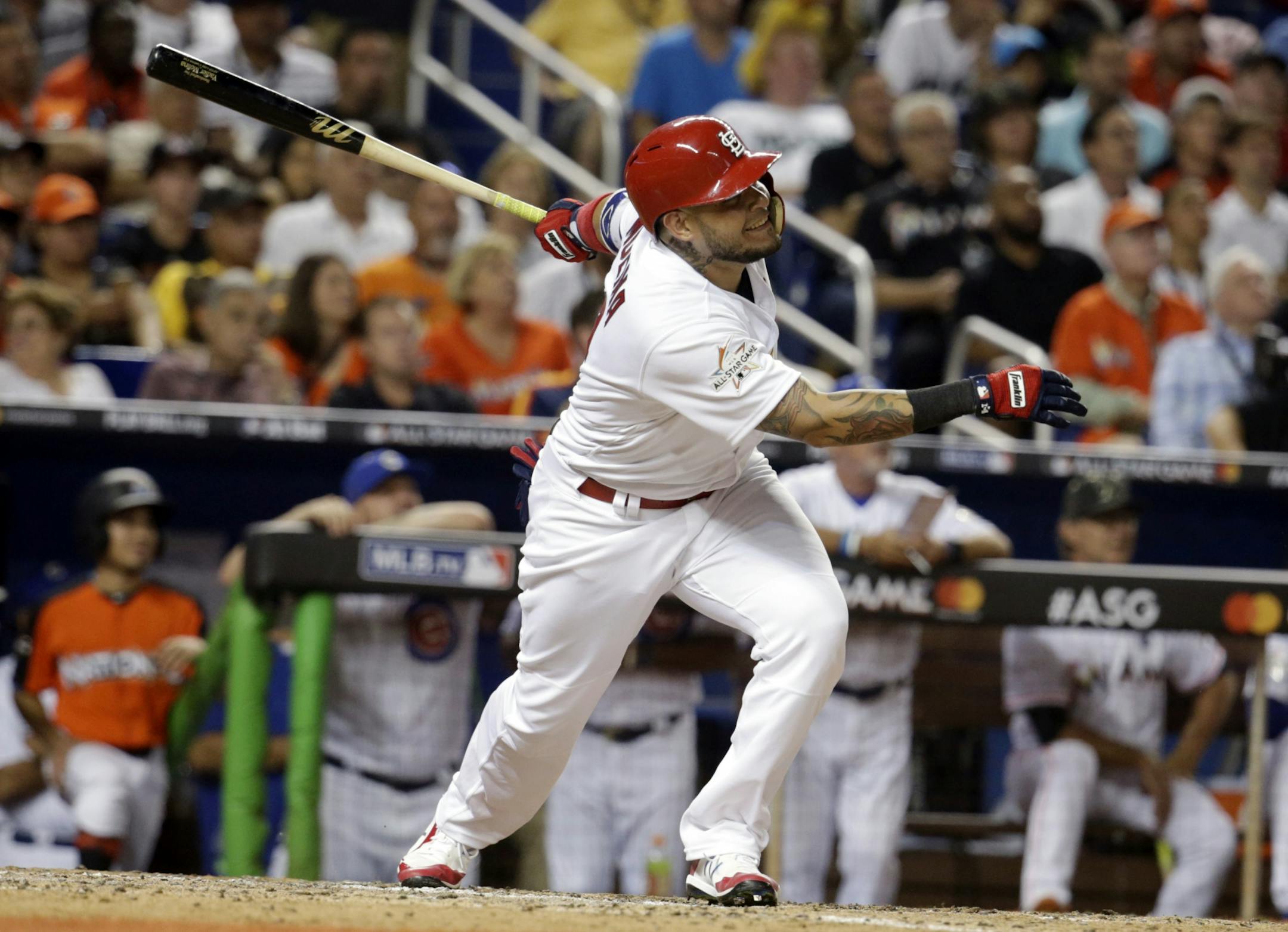 National League's St. Louis Cardinals catcher Yadier Molina (4), hits a homerun in the sixth inning, during the MLB baseball All-Star Game, Tuesday, July 11, 2017, in Miami.
