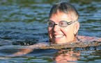 Endurance swimmer Karen Zemlin, who is training for her attempt at swimming the English Channel in August, took in an early swim at Lake Minnetonka, T