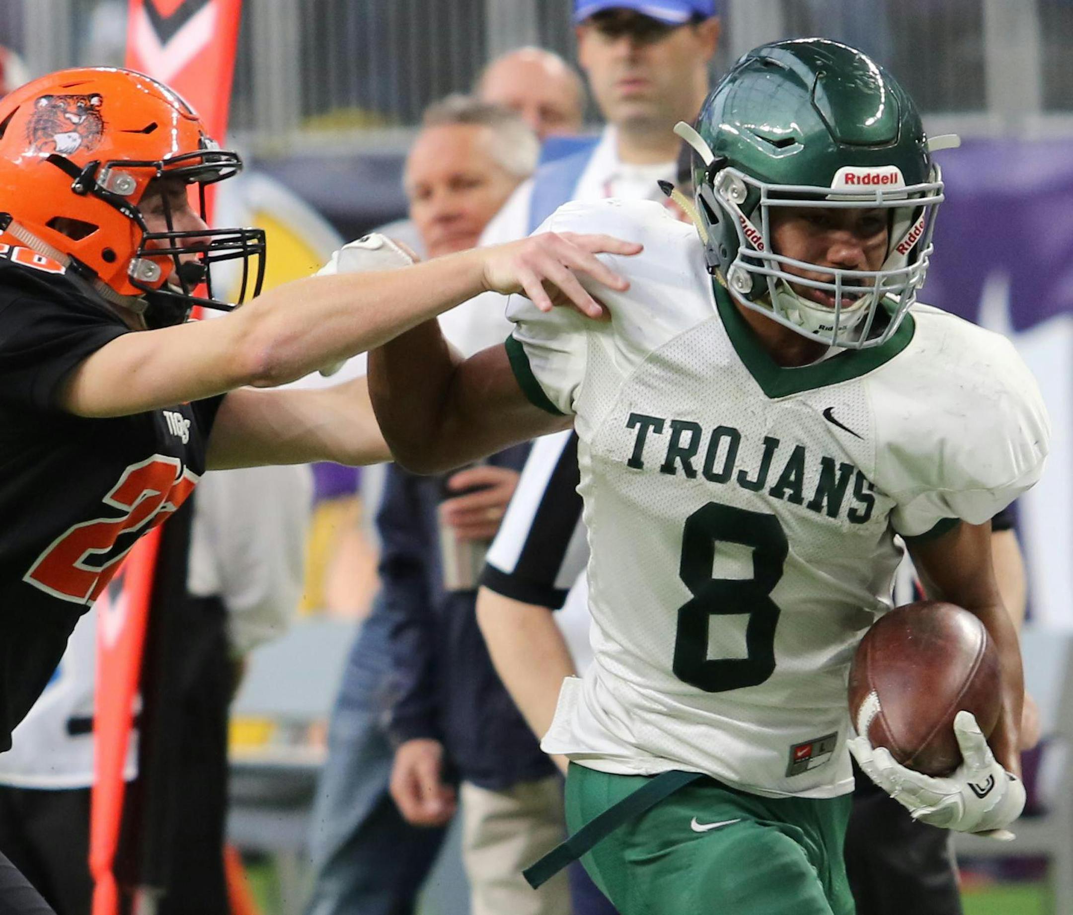 Rushford-Peterson's Noah Carlson (8) rushes past Browerville defender Matthew May (20) in the Class 1A semifinal game at U.S. Bank Stadium on Saturday.