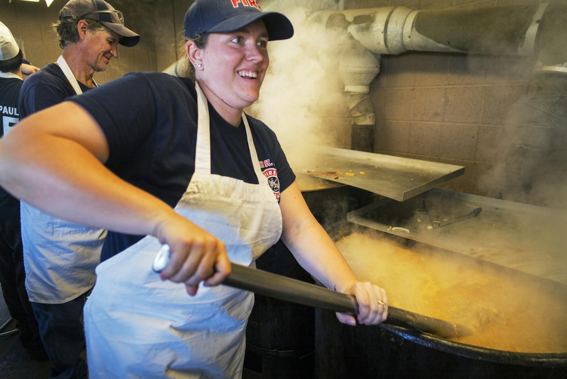 At Casey Lake Park in North St. Paul where the fire department held its annual booya fundraiser, Tracy Larson jokingly said she might have to go to the gym this week as she stirred the stew for hours on end.