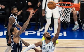 Timberwolves guard Mike Conley scored a first-half basket tonight at Target Center.