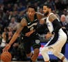 Minnesota Timberwolves guard Jeff Teague (0) took the ball around Orlando Magic guard D.J. Augustin (14) in the first half. ] ANTHONY SOUFFLE &#x2022;