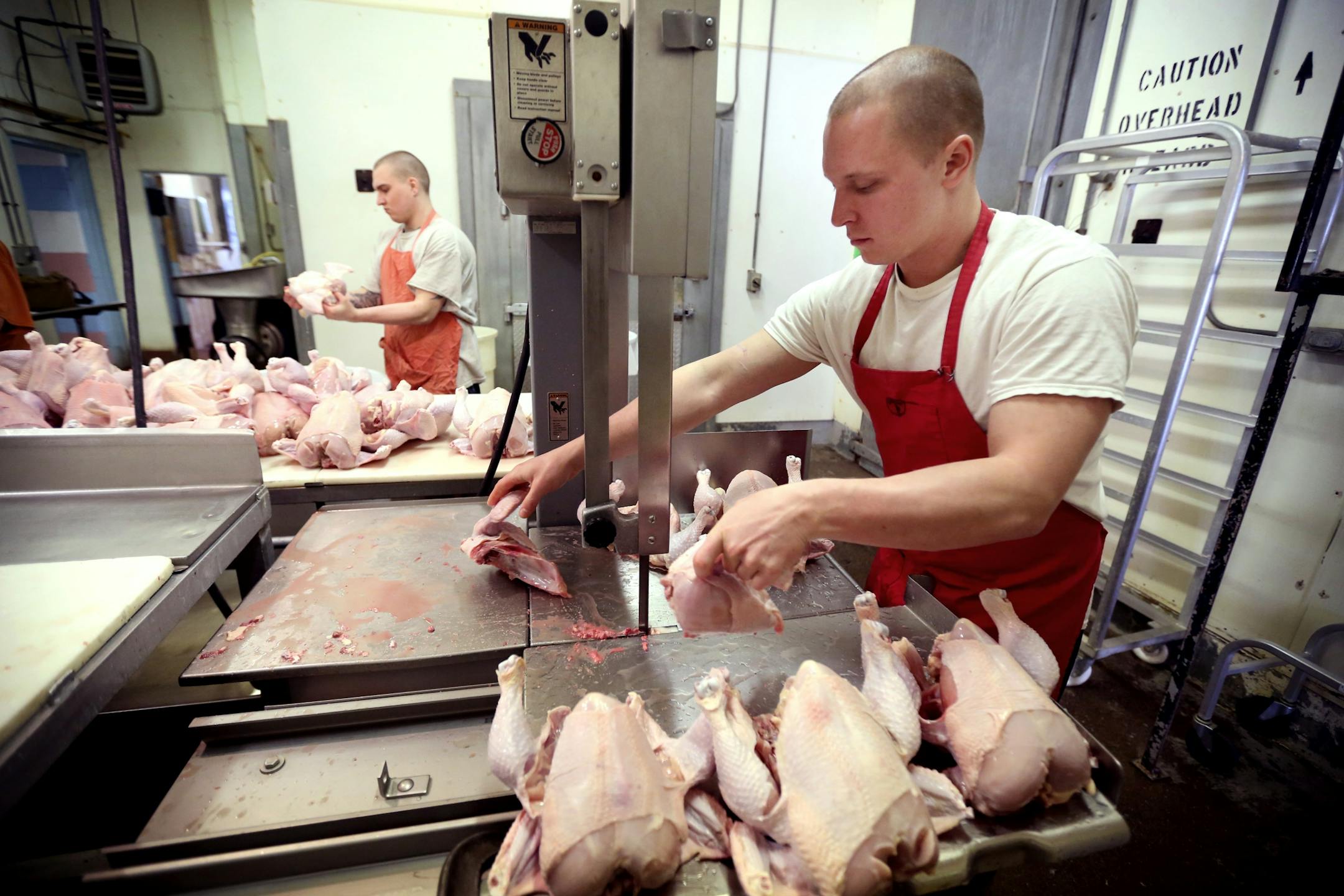 Shawn Wirta right and Zach Malich inmates at the Northeast Regional Corrections Center butchered chickens. Inmates at the Northeast Regional Corrections Center butcher chickens and pigs mostly to eat later in the week for lunch. A few lawmakers want to turn that loose program into a certification-granting curriculum with the idea that it will help the men get jobs and, more broadly, respond to a shortage of butchers.