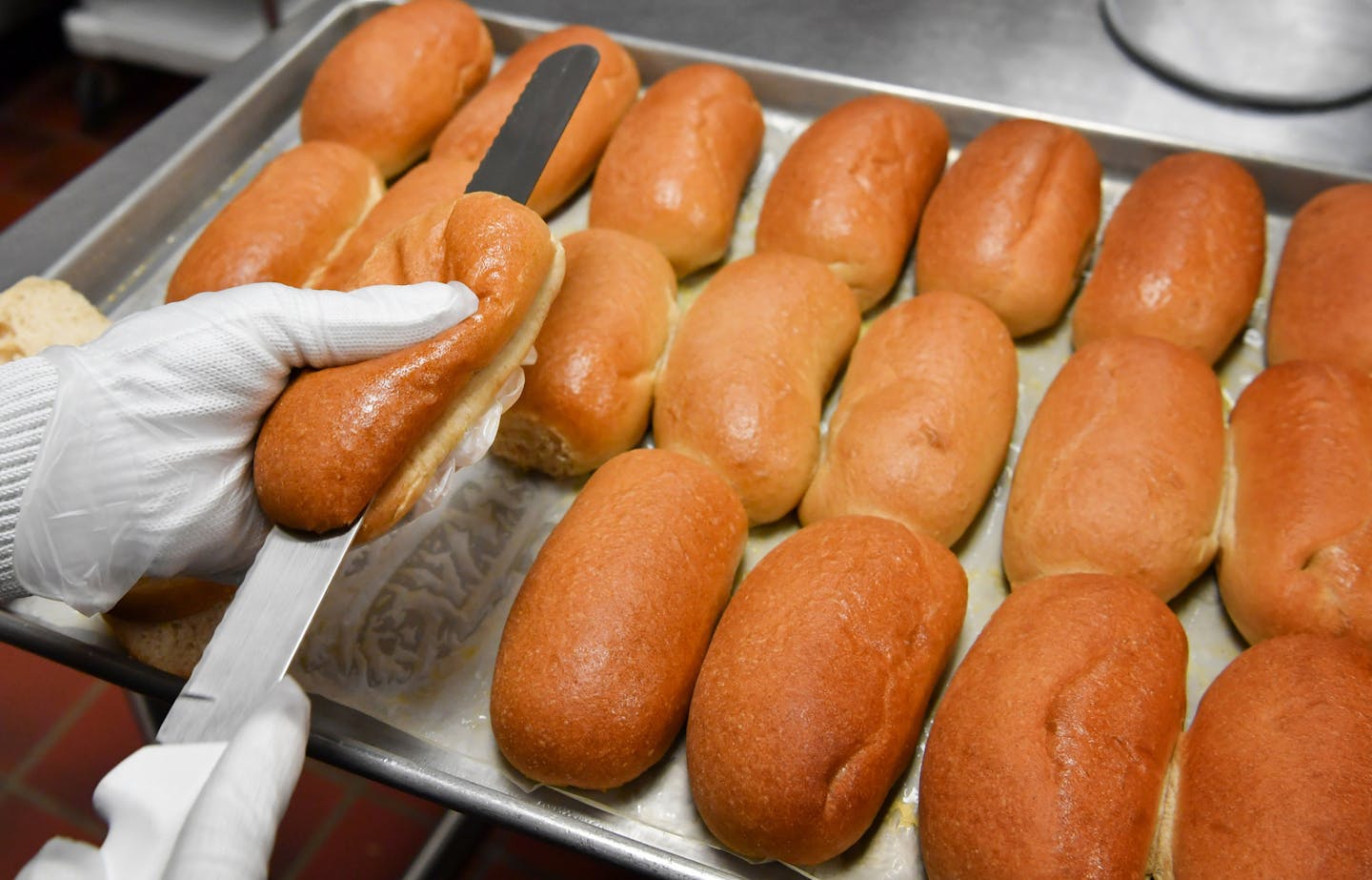 Jan Young, kitchen manager for Chaska Middle School cut some freshly baked whole-grain sub rolls for the 460 hungry students in her school. ] GLEN STUBBE * gstubbe@startribune.com Monday, September 19, 2016 New studies show that schools have made significant improvements in school lunches from farm-to-school initiatives, hired chefs and simple scratch recipes. But Minnesota parents are still concerned that students are not getting the best options.