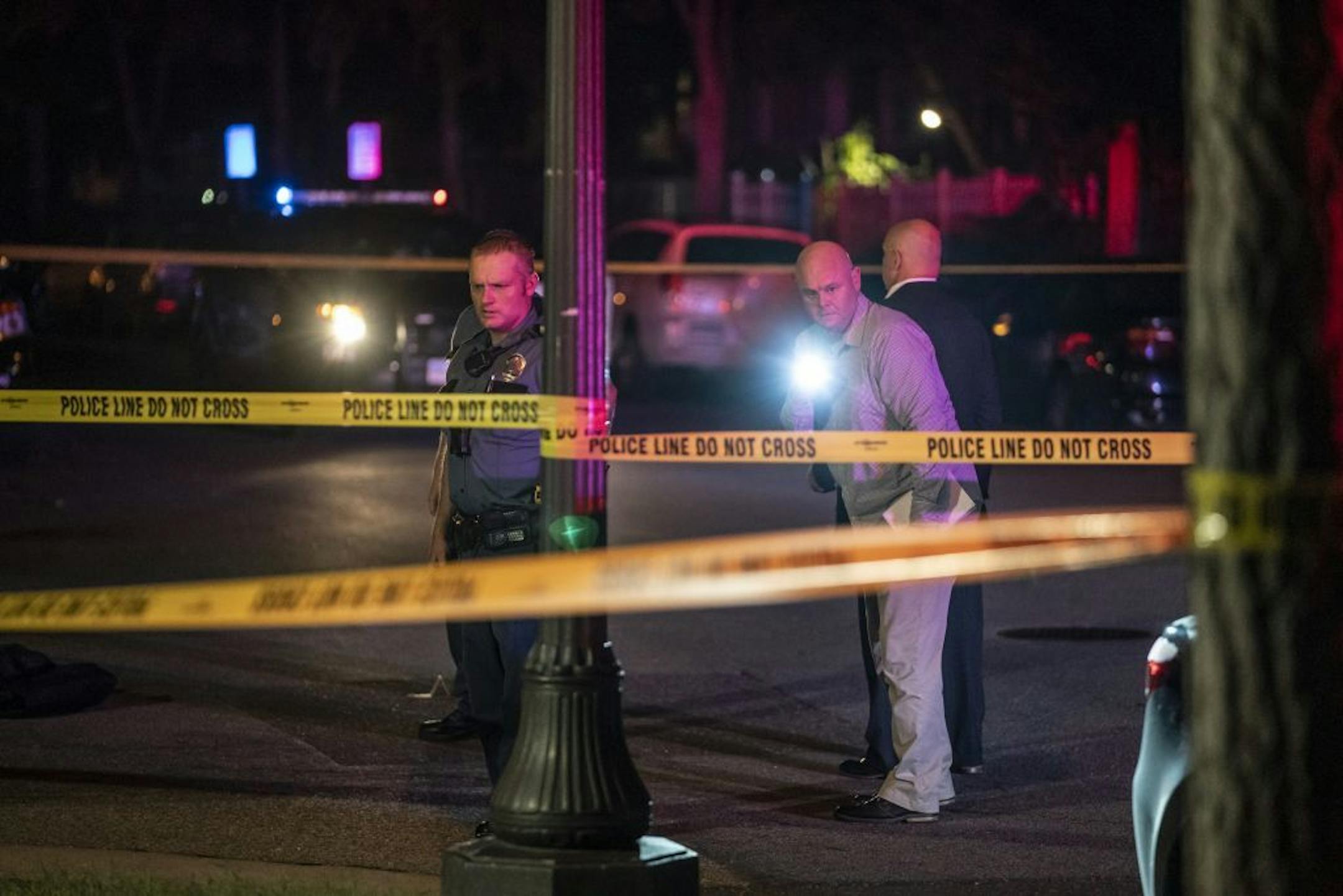 Investigators walked through the scene of a homicide in St. Paul, Minn., on the evening of Wednesday, September 18, 2019.