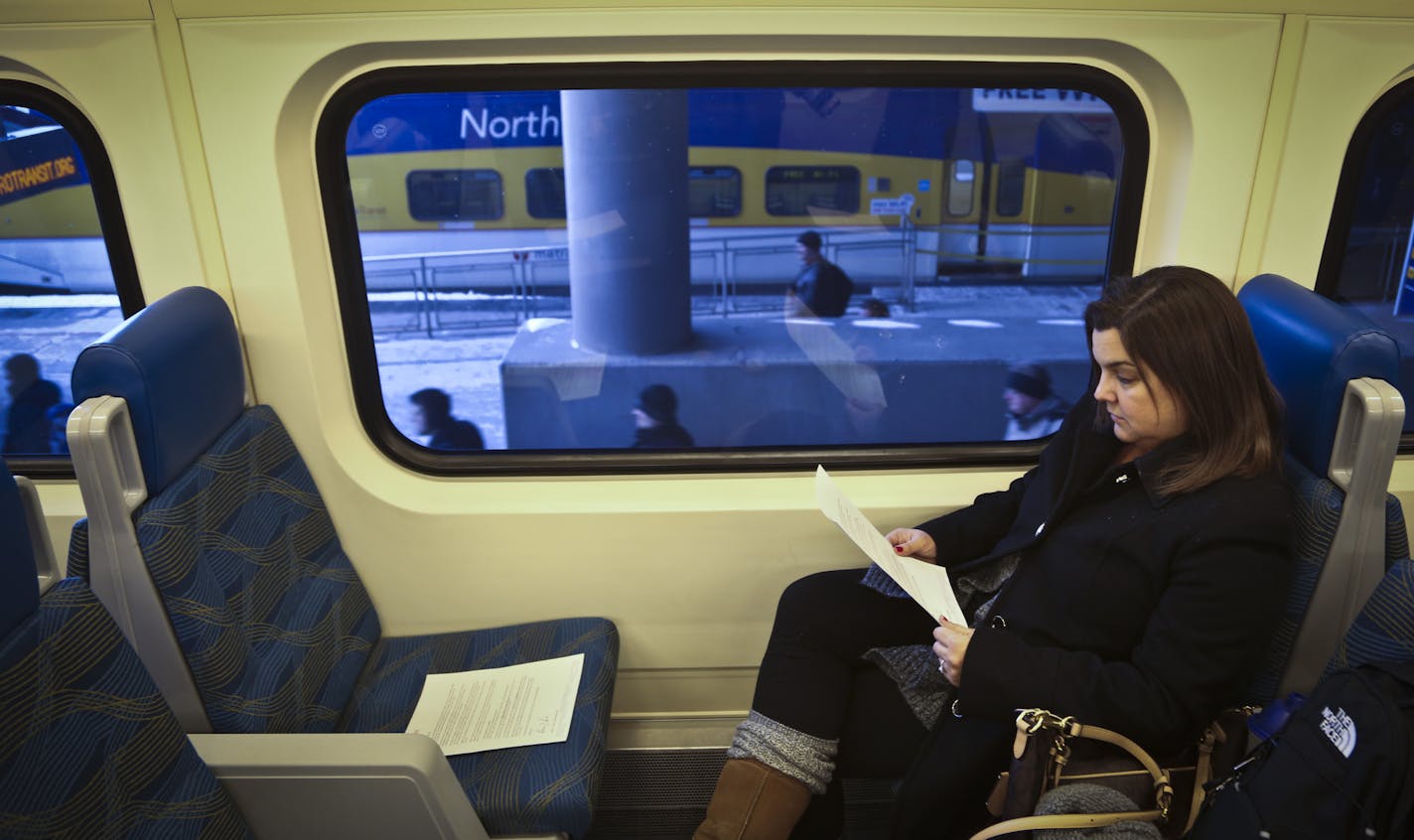 Michele Paddock, of Andover, read a letter from Metro Transit she found on her chair apologizing for their recent unpredictable delays on the NorthStar commuter train in Minneapolis, Minn., on Thursday, February 6, 2014. Paddock says her trains have been late at least two or three times a week, sometimes up to an hour, in the last couple months. ] (RENEE JONES SCHNEIDER reneejones@startribune.com)