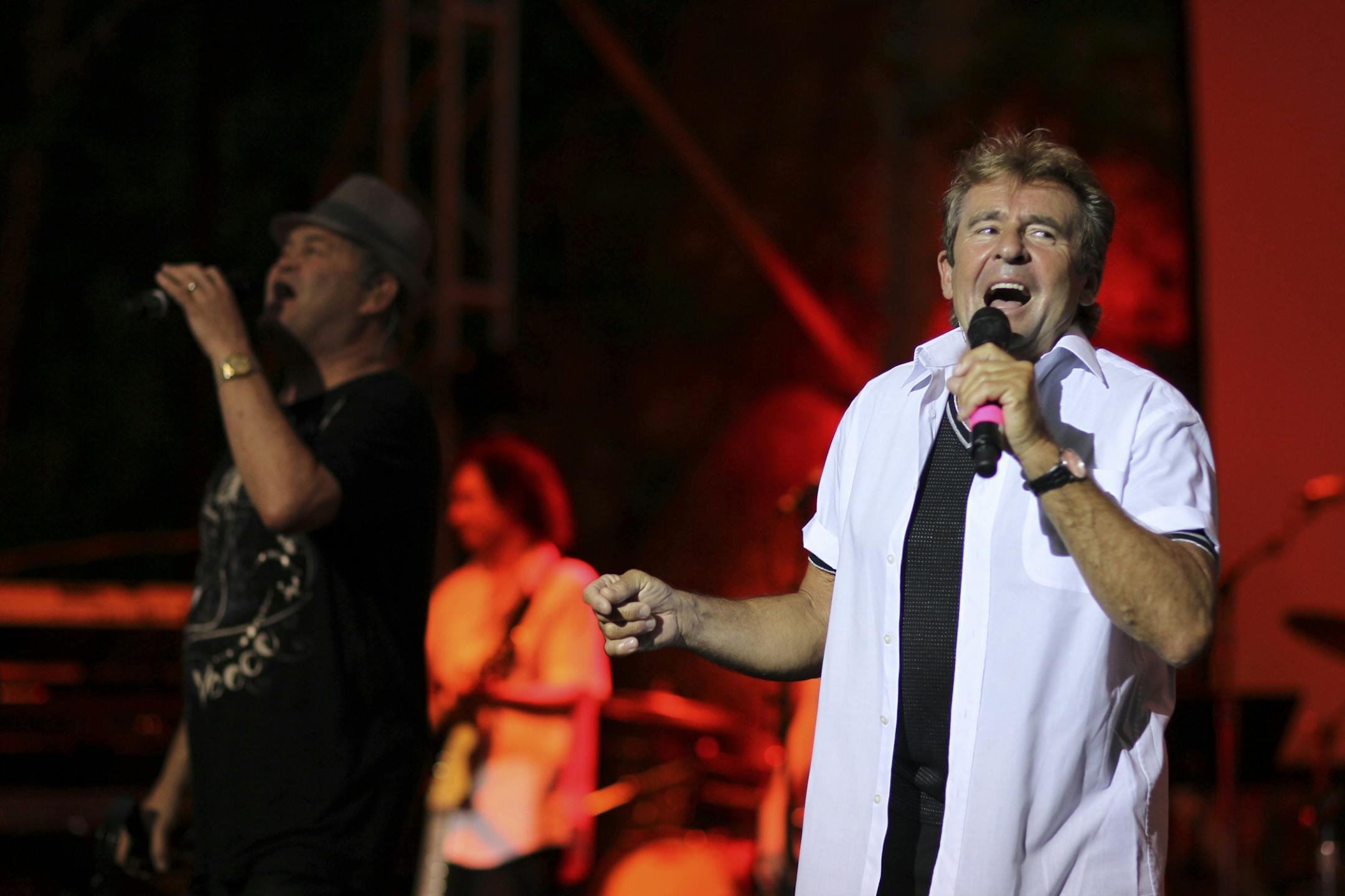 Micky Dolenz, left, and Davy Jones, sang the Monkees hit "I'm a Believer" early in their set at the the Minnesota Zoo Amphitheater in Apple Valley Friday night, July 1, 2011.