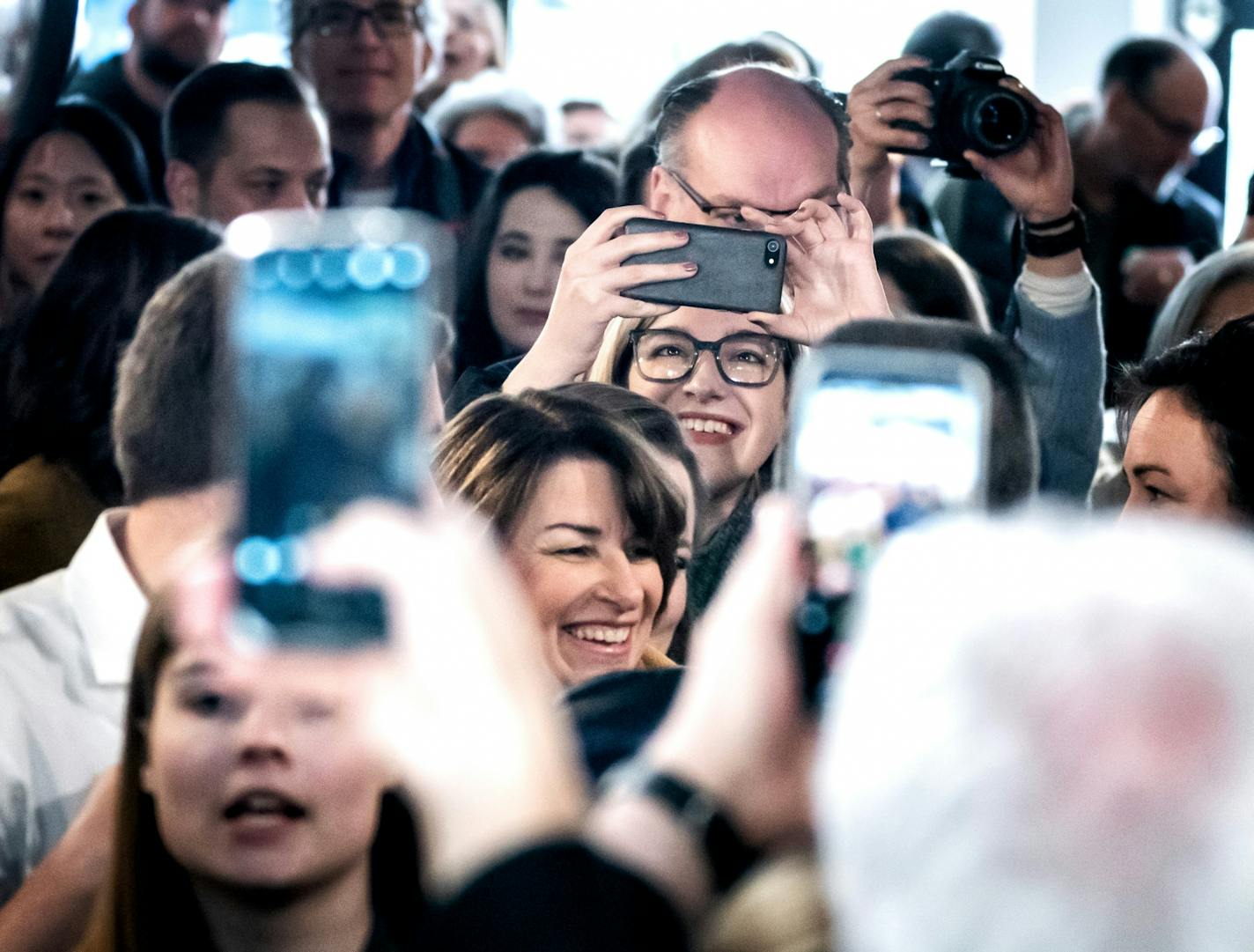 Amy Klobuchar entered SHIFT Cyclery & Coffee Bar followed by her daughter Abigail and husband John. She made her first campaign appearance as a presidential candidate in Eau Clare, Wisconsin since announcing her candidacy earlier in the week.