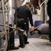 Metro Transit police wake a woman who was sleeping across two seats at night on a light-rail train. ] ANTHONY SOUFFLE &#x2022; anthony.souffle@startri