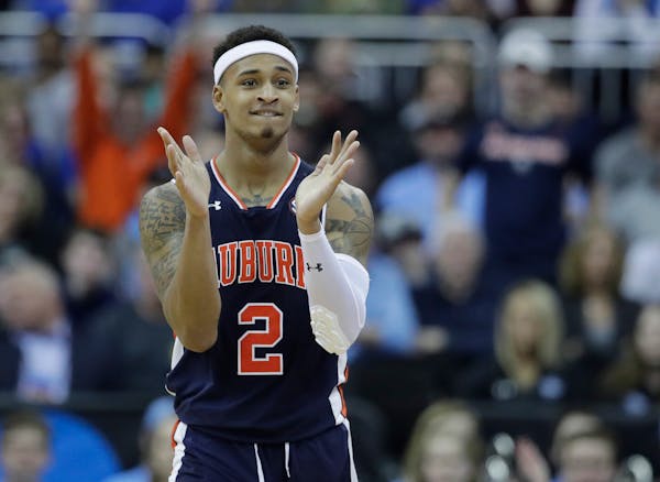Auburn's Bryce Brown applauds during the second half