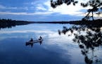 Two men paddle on Conmee Lake back to camp after an evening of fishing in Quetico Provincial Park earlier this month. Conmee Lake is one of the lakes 