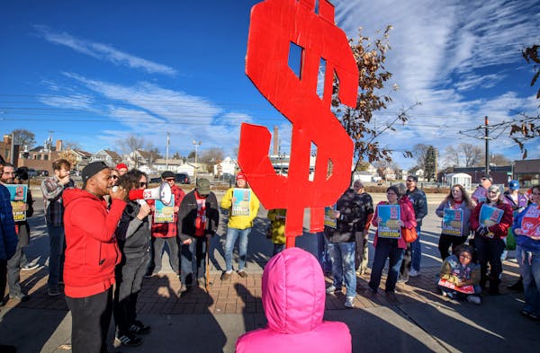 Supporters of the $15 minimum wage for St. Paul rallied in front of Walmart in the Midway area of St. Paul Friday morning. ] GLEN STUBBE &#xef; glen.s