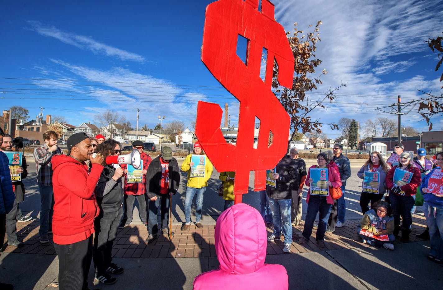 Supporters of the $15 minimum wage for St. Paul rallied in front of Walmart in the Midway area of St. Paul Friday morning. ] GLEN STUBBE &#xef; glen.stubbe@startribune.com Friday, November 24, 2017 this time: Supporters of the $15 min wage expect a couple dozen people to gather as they push for change in St. Paul: "Rally with us on Black Friday to support workers organizing for living wages and fair work conditions and send a clear message: we need $15/hour for every worker in St Paul, no exempt