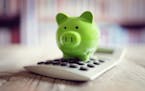 Piggy bank on calculator concept for saving, accounting, banking and business account. istock