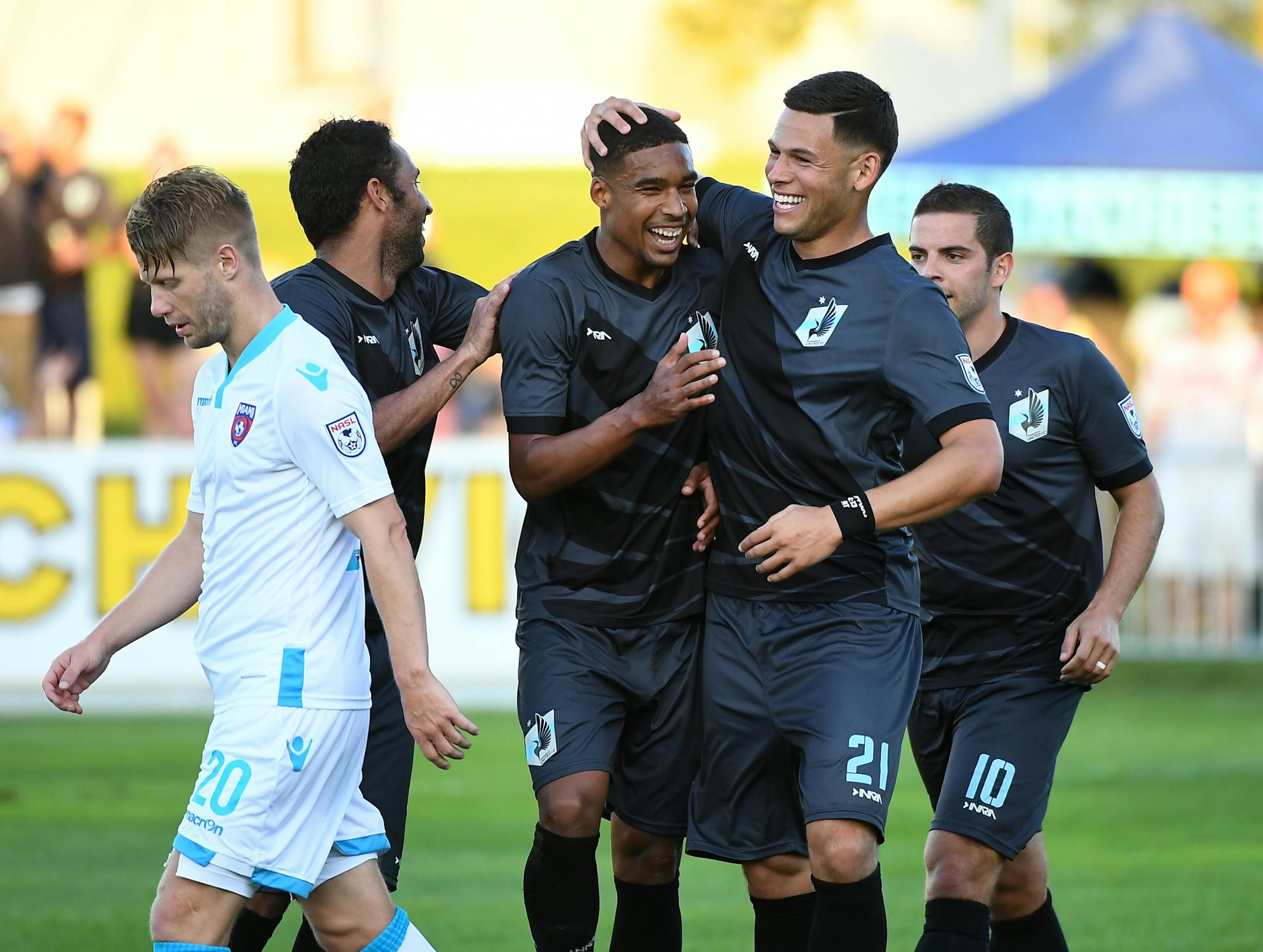 Minnesota United FC players including midfielder Ibson (7), forward Stefano Pinho (11), forward Christian Ramirez (21) and forward Ben Speas (10) celebrated a goal by Pinho