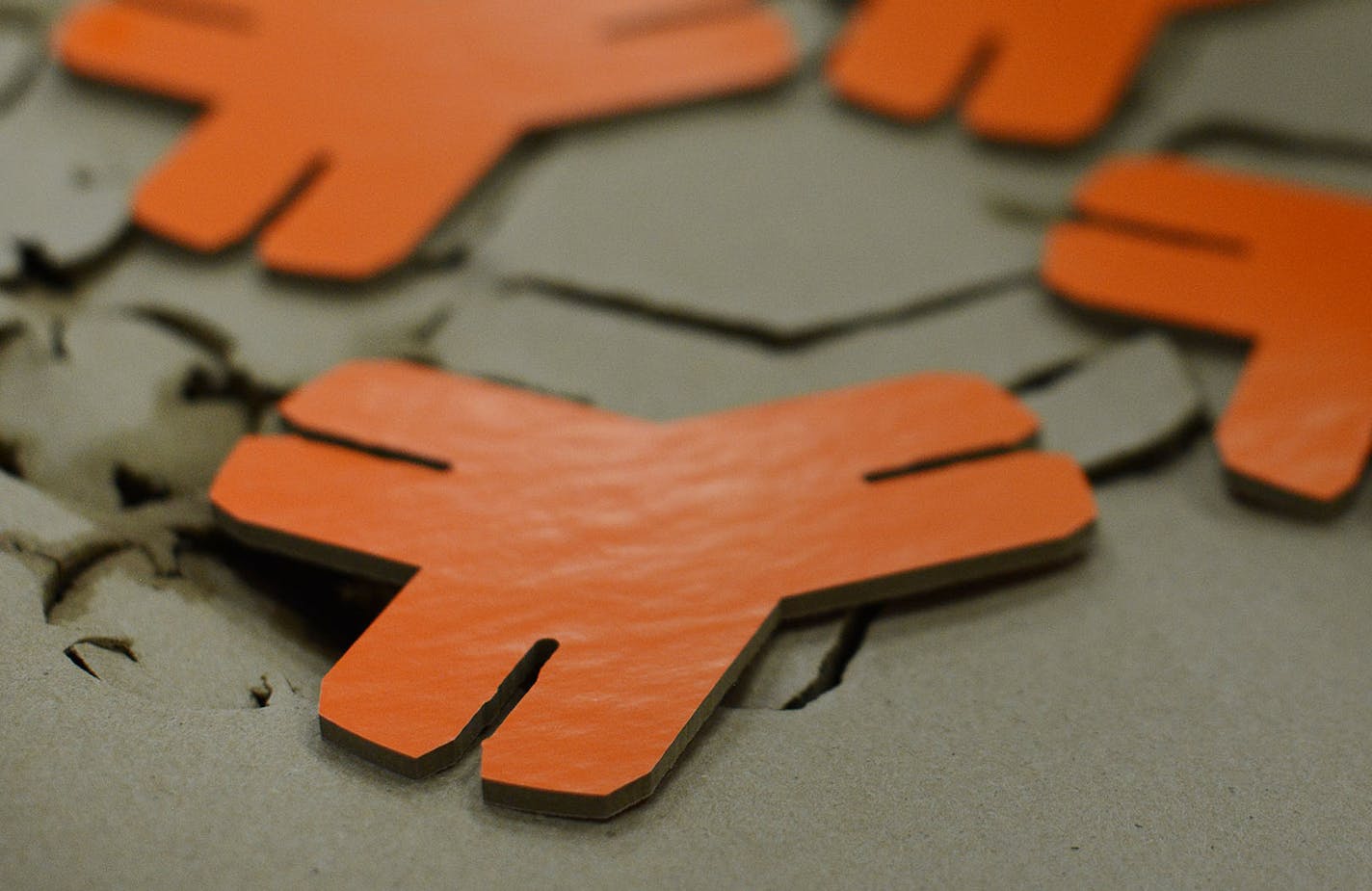 Wood pieces sat after being cut by the high pressure water jet machine using 66 thousand pounds of water pressure. The wood pieces are part of the YOXO toy packages at the YOXO production building in St. Paul, Minn., on Wednesday June 3, 2015. YOXO toys are built from eco-friendly materials, primarily recycled wood pulp. The toys include construction kits with suggested creations but can connect with all different kinds of objects. ] RACHEL WOOLF rachel.woolf@startribune.com