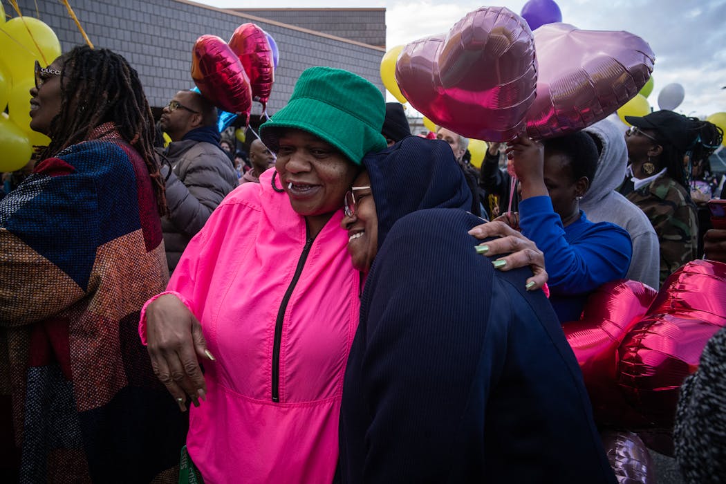 Sammy McDowell’s sister Shaawn-Dai McDowell, left, hugs Robbin Brown at a celebration of Sammy McDowell’s life at Shiloh Temple International in Minneapolis on Tuesday.
