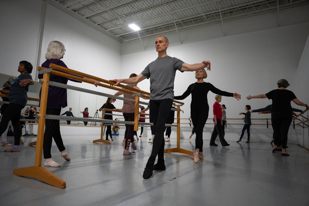Matthew LaVoie held onto the barre during a Boomer Ballet class, which can improve strength, balance, posture, flexibility and be cognitively challenging.