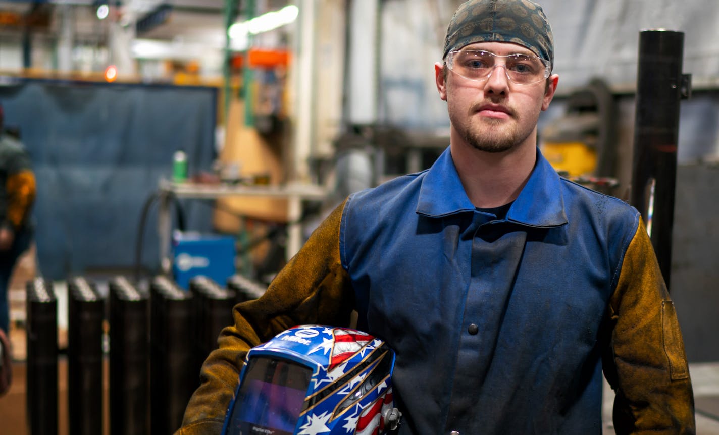 Dillon Blommer, graduated from Dunwoody in 2012, now works at Graco. ] GLEN STUBBE &#x2022; glen.stubbe@startribune.com Thursday, February 14, 2019 Graco, Dunwoody College & Fanuc team up to teach people to completely automate assembly lines with new robots. Graco added 24 robots in last few years. Two more robots arrive in two weeks. The robots (xome $1 million) are the answer to a hiring shortage that has caused product delays to customers. Need pix of Randy Barcus & employees w/ robotic manuf