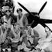 An undated handout photo of James Muri, second from left in the front row, with his crew and the B-26 bomber he flew over the Pacific on June 4, 1942.